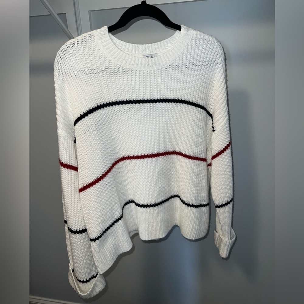 Red and dark blue (almost black) striped white sweater